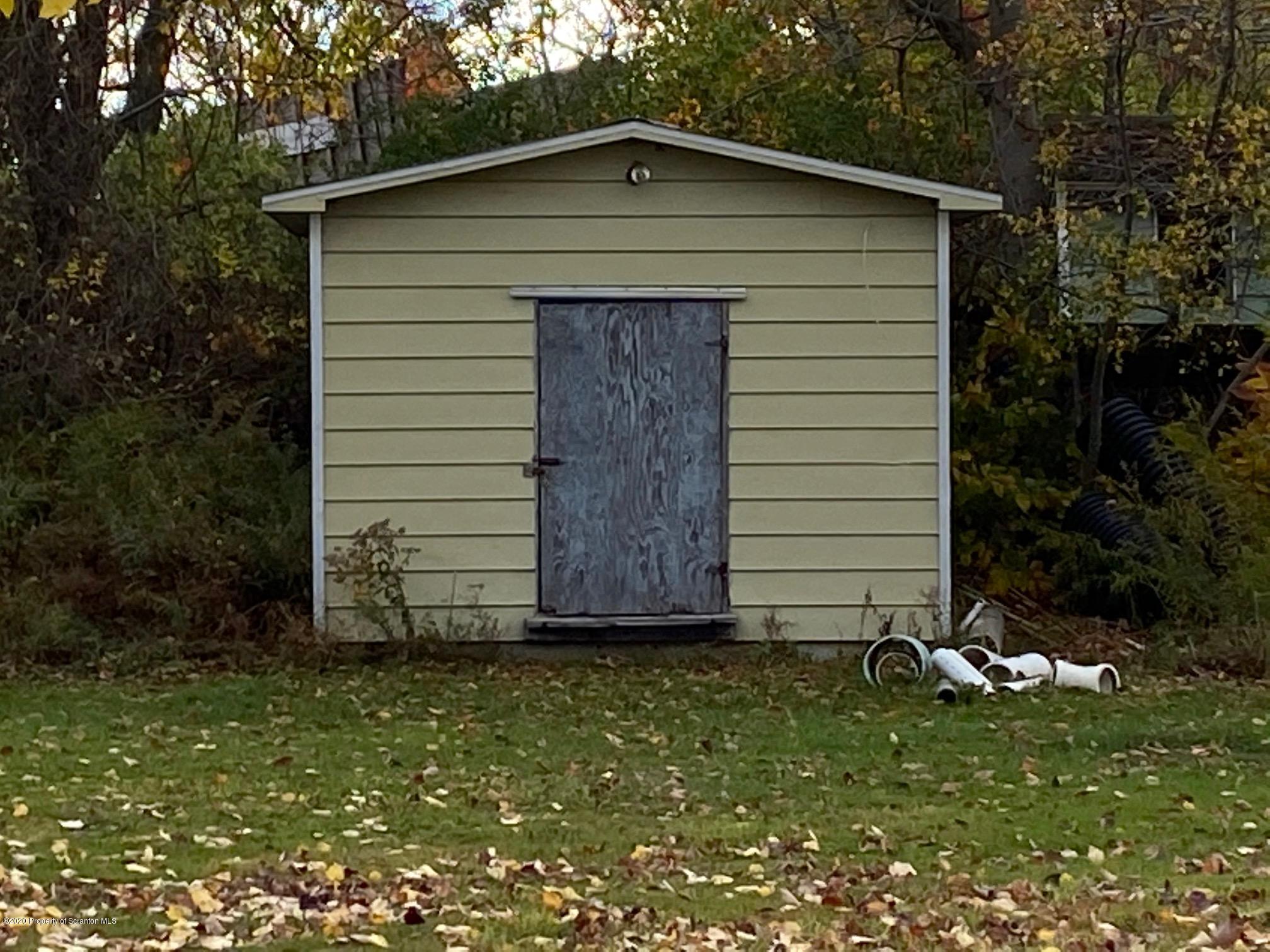 25 Dennis Road Scott Township, PA 18447 - Photo 43 of 43 a front view of a house with garden