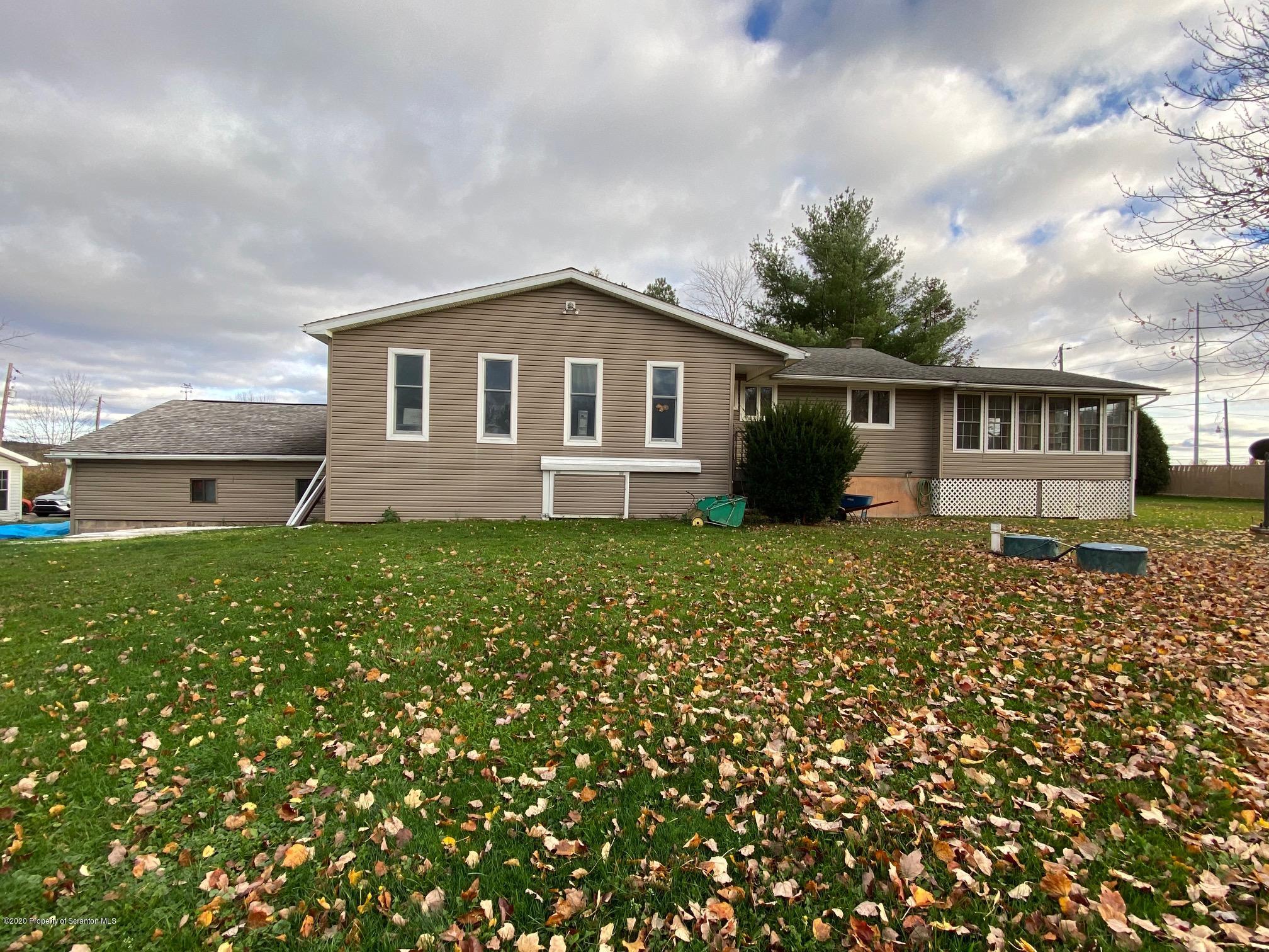 25 Dennis Road Scott Township, PA 18447 - Photo 5 of 43 a front view of a house with a garden
