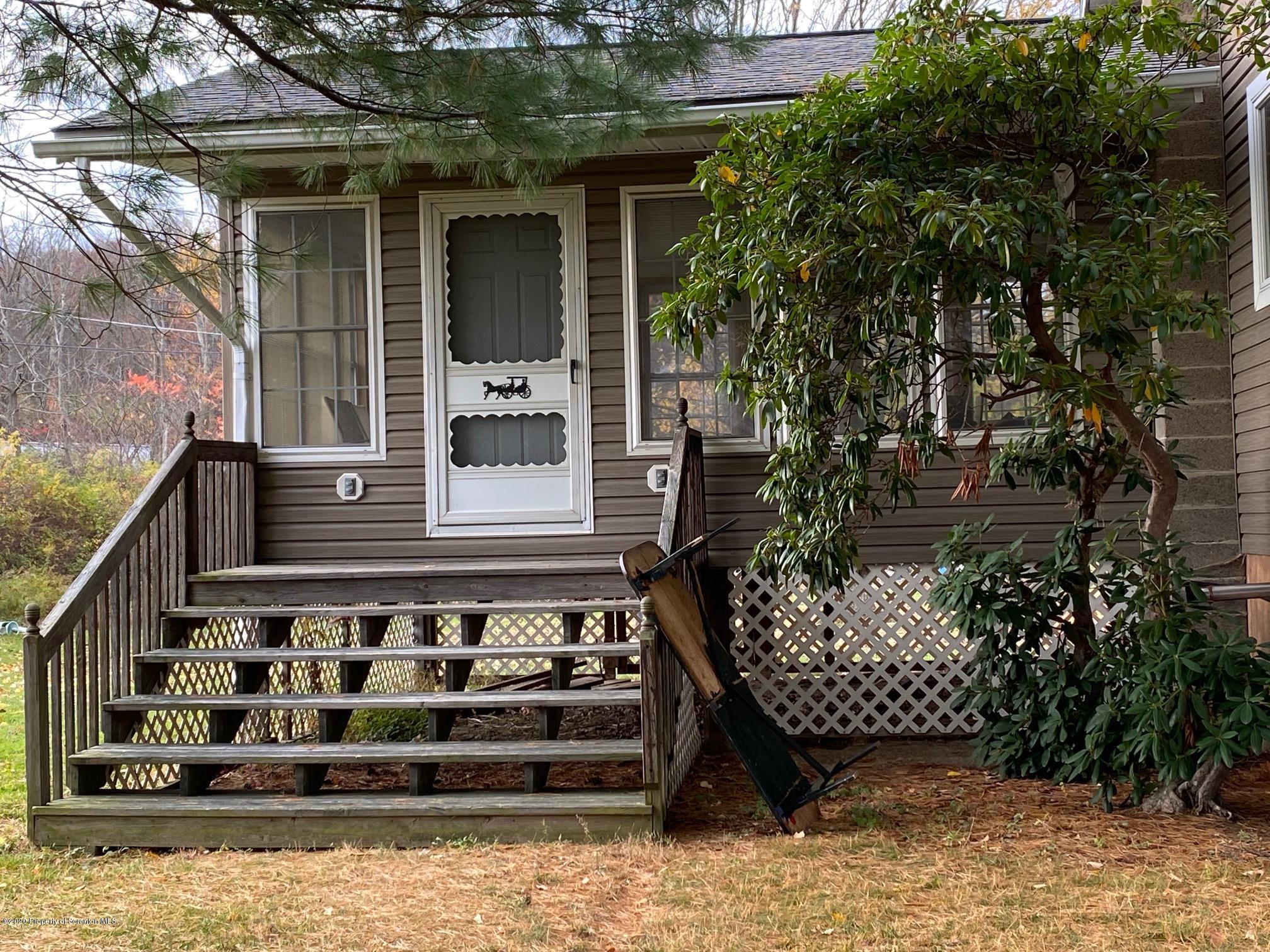 25 Dennis Road Scott Township, PA 18447 - Photo 6 of 43 a view of a chair and table of the house in front of it
