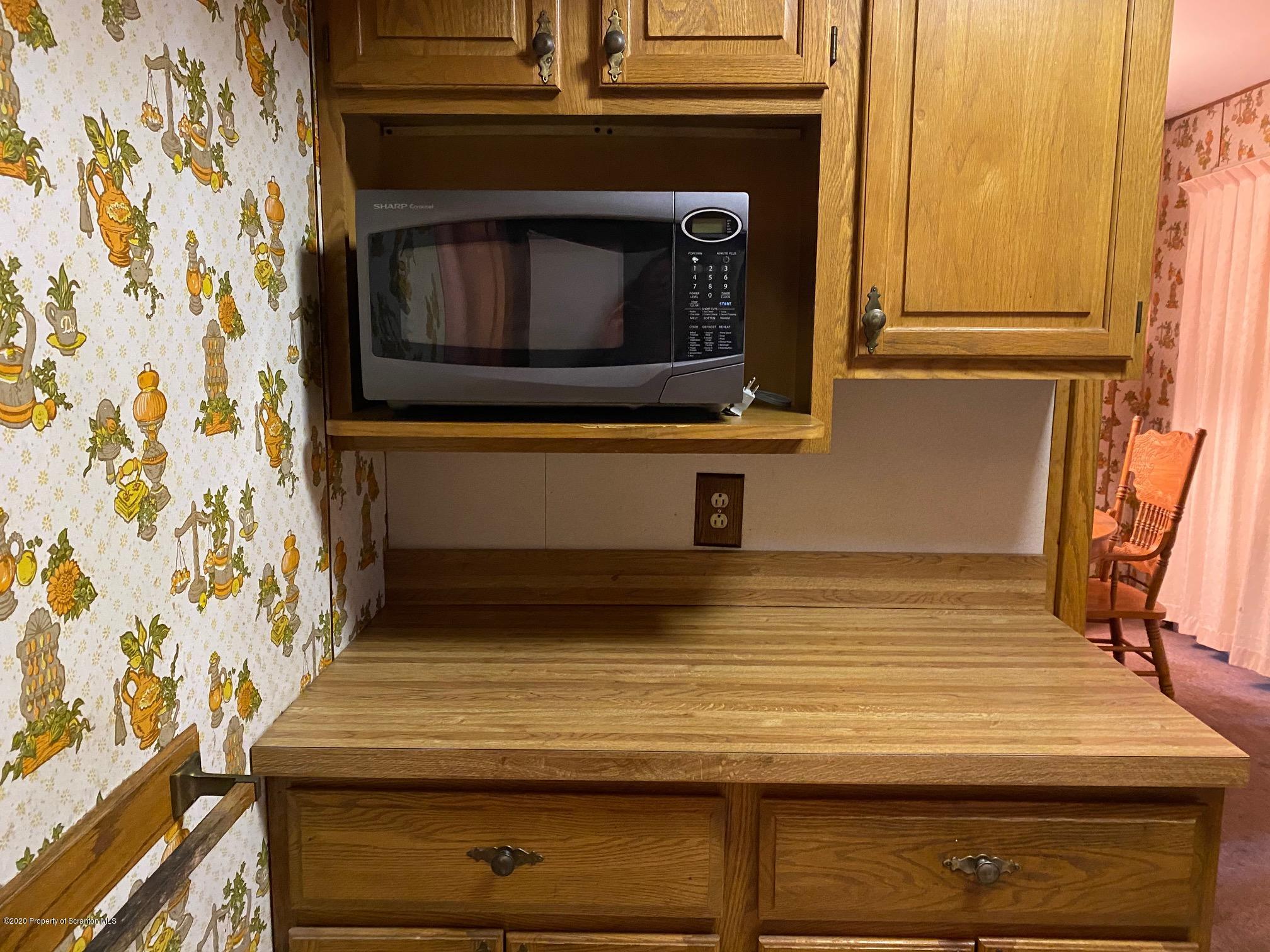 25 Dennis Road Scott Township, PA 18447 - Photo 10 of 43 a bathroom with a stove and a microwave