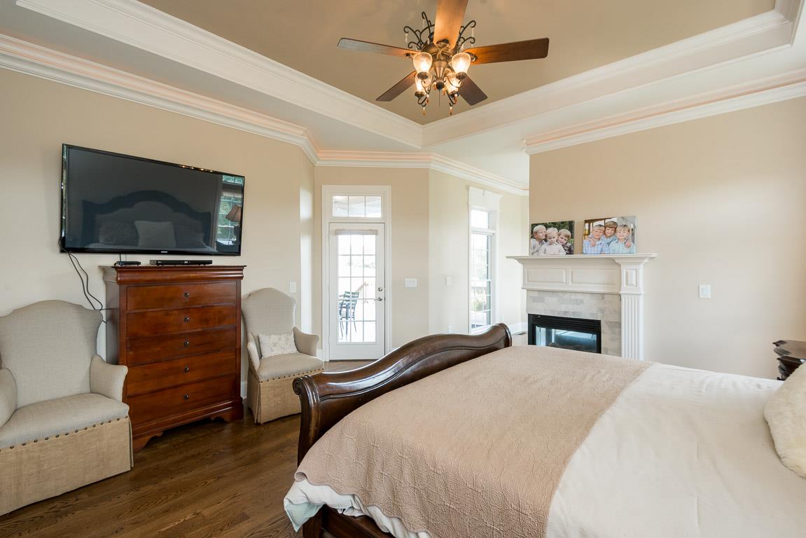 4248 Crowder Road Franklin, TN 37064 - Photo 13 of 29 a spacious bedroom with a bed and a flat screen tv