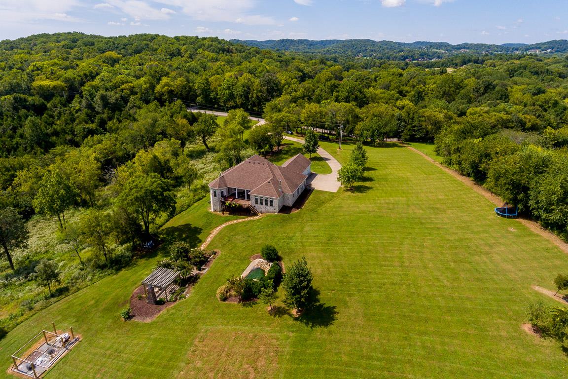 4248 Crowder Road Franklin, TN 37064 - Photo 2 of 29 a view of a swimming pool with a yard