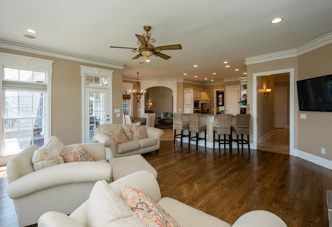 4248 Crowder Road Franklin, TN 37064 - Photo 21 of 29 a living room with furniture kitchen view and a wooden floor