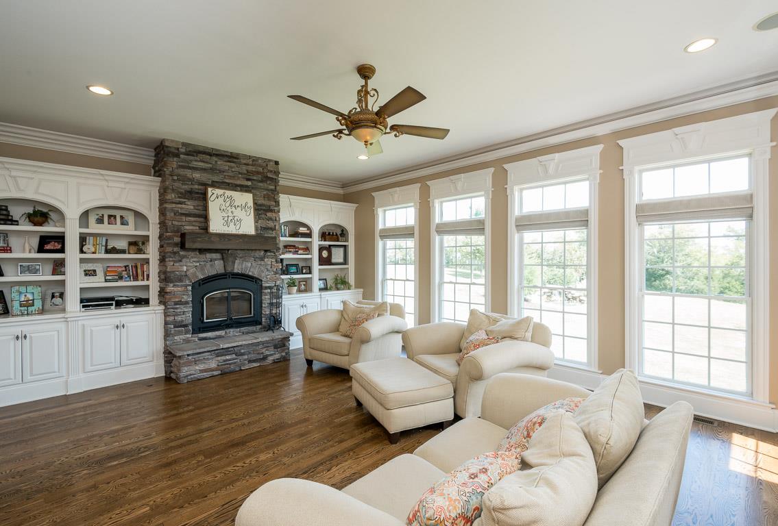 4248 Crowder Road Franklin, TN 37064 - Photo 22 of 29 a living room with furniture fireplace and flat screen tv