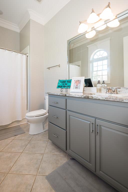4248 Crowder Road Franklin, TN 37064 - Photo 25 of 29 a bathroom with a granite countertop sink a toilet and a mirror