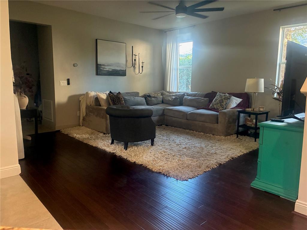 960 Seburn Road Apopka, FL 32703 - Photo 8 of 13 a living room with furniture and a flat screen tv