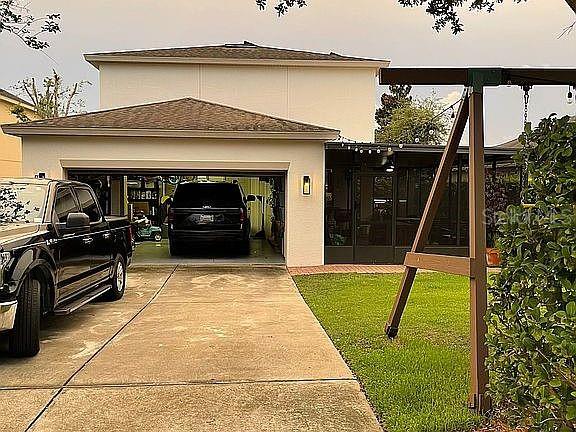 960 Seburn Road Apopka, FL 32703 - Photo 9 of 13 a front view of a house with a garden