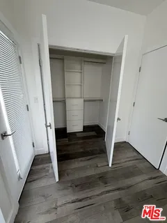 a storage room with wooden floor