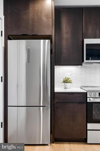 a view of a refrigerator in kitchen