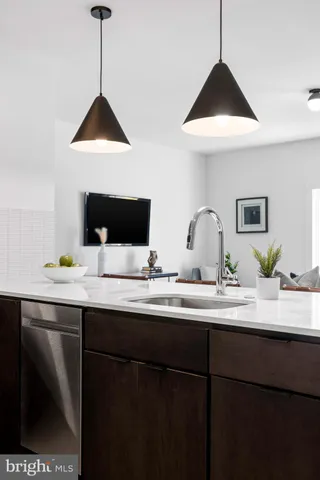 a kitchen with a sink and cabinets