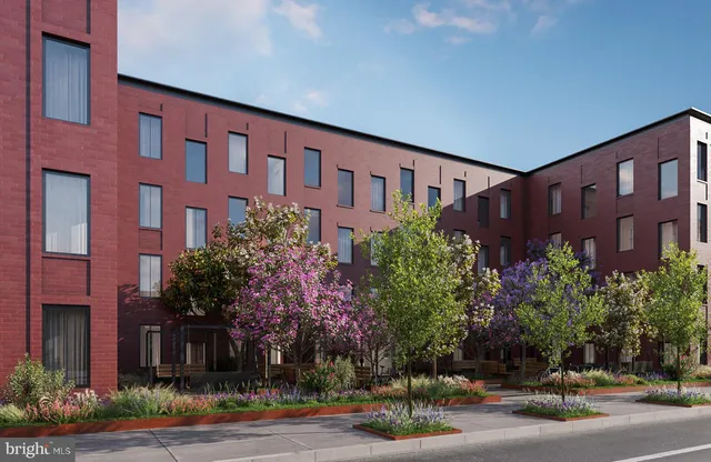 a front view of building with yard