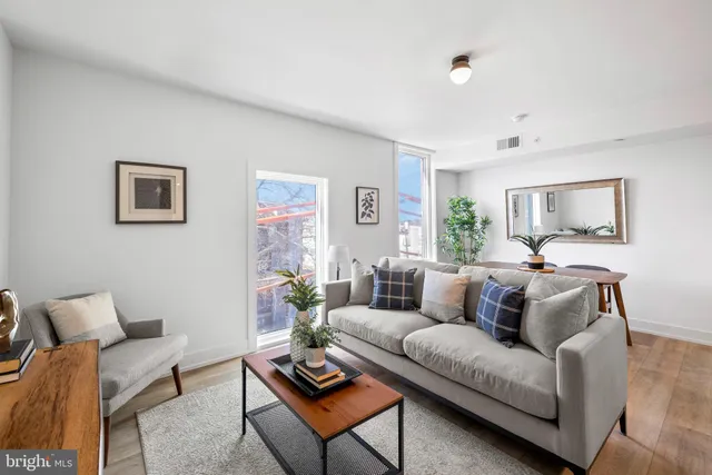 a living room with furniture and a couch