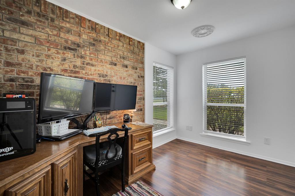 430 Carter Road Italy, TX 76651 - Photo 29 of 36 a workspace with furniture and a flat screen tv