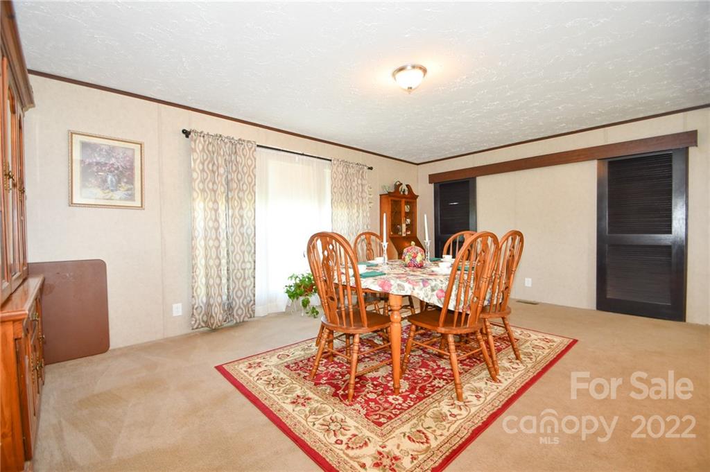 1816 Russell Pope Road Wingate, NC 28174 - Photo 13 of 23 a dining room with furniture and window
