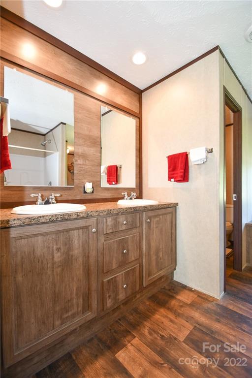 1816 Russell Pope Road Wingate, NC 28174 - Photo 17 of 23 a kitchen with a sink cabinets and wooden floor