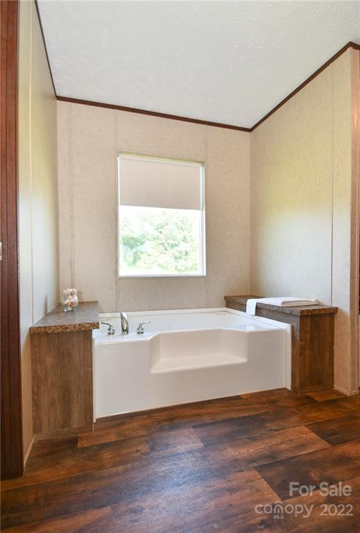 1816 Russell Pope Road Wingate, NC 28174 - Photo 18 of 23 a view of a kitchen with a large window a sink and a refrigerator
