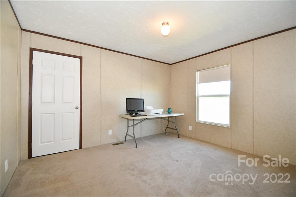 1816 Russell Pope Road Wingate, NC 28174 - Photo 19 of 23 a living room with furniture and a window