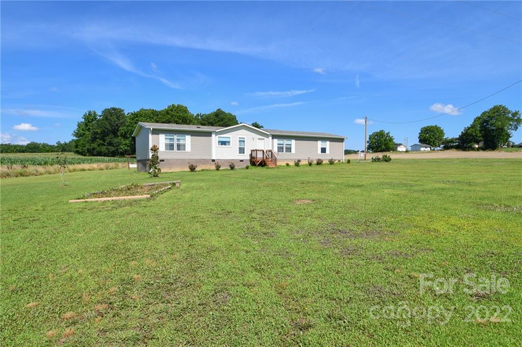 1816 Russell Pope Road Wingate, NC 28174 - Photo 2 of 23 a house view with a outdoor space
