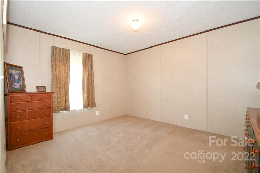 1816 Russell Pope Road Wingate, NC 28174 - Photo 21 of 23 an empty room with cabinet and cabinet