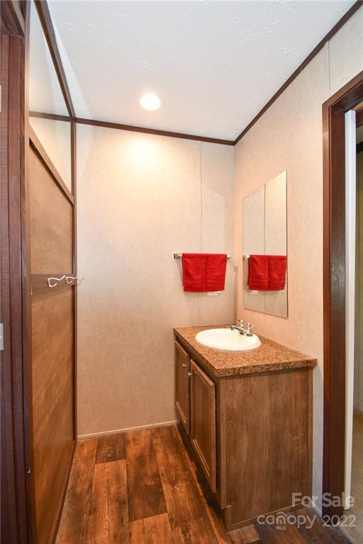 1816 Russell Pope Road Wingate, NC 28174 - Photo 23 of 23 a bathroom with a sink and a mirror