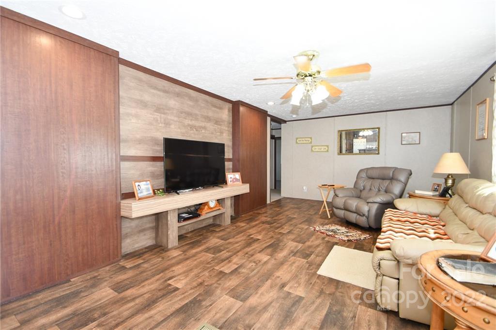 1816 Russell Pope Road Wingate, NC 28174 - Photo 5 of 23 a living room with furniture and a flat screen tv