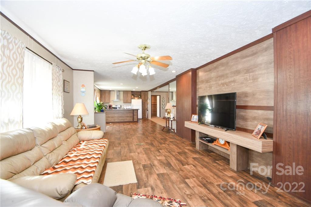 1816 Russell Pope Road Wingate, NC 28174 - Photo 7 of 23 a living room with furniture and a flat screen tv
