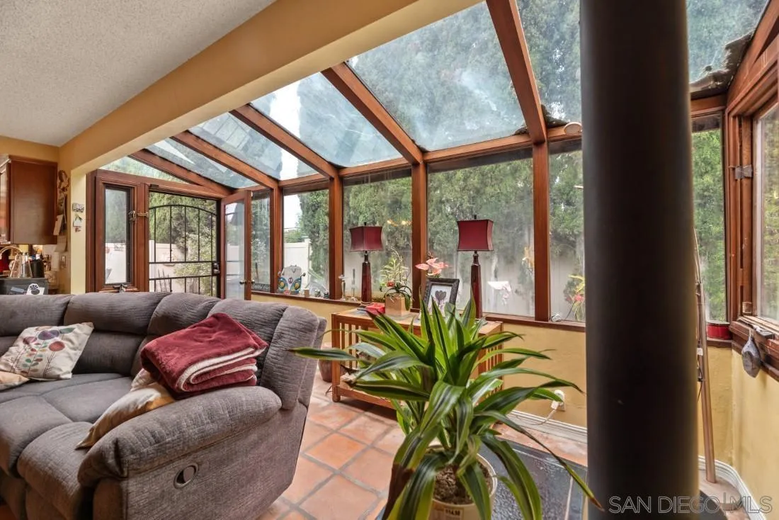 894 Coldstream Drive El Cajon, CA 92020 - Photo 11 of 30 a living room with furniture and floor to ceiling windows