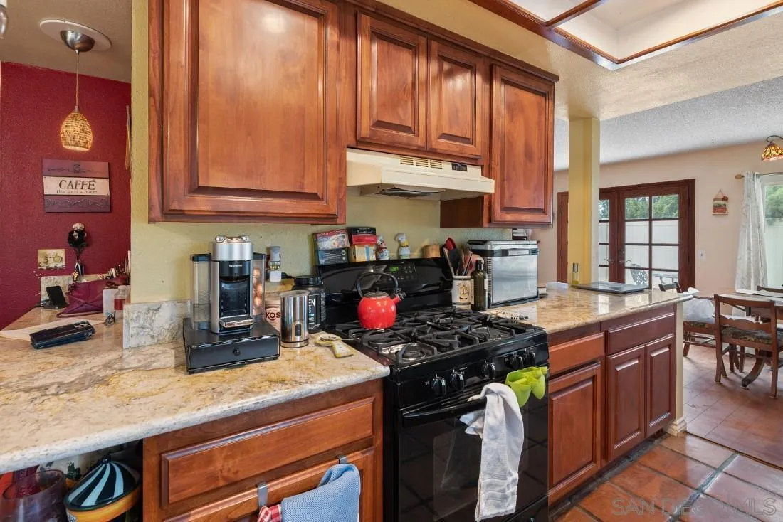 894 Coldstream Drive El Cajon, CA 92020 - Photo 15 of 30 a kitchen with a stove and a sink