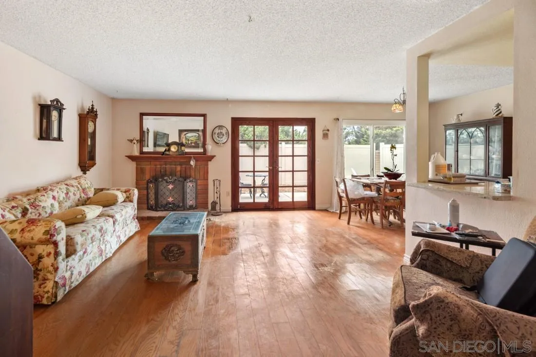 894 Coldstream Drive El Cajon, CA 92020 - Photo 17 of 30 a living room with furniture and a floor to ceiling window