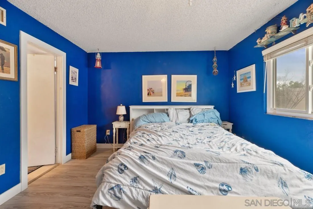 894 Coldstream Drive El Cajon, CA 92020 - Photo 21 of 30 a bedroom with a bed and a large mirror