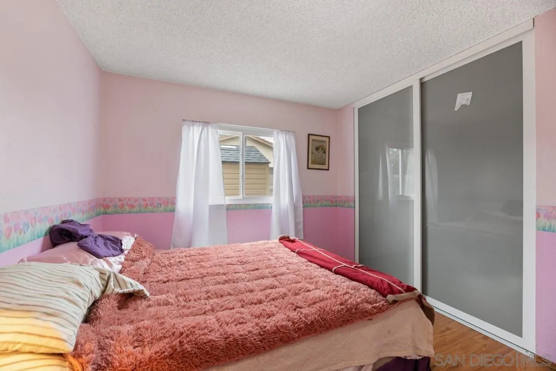894 Coldstream Drive El Cajon, CA 92020 - Photo 25 of 30 a bedroom with a bed and a window