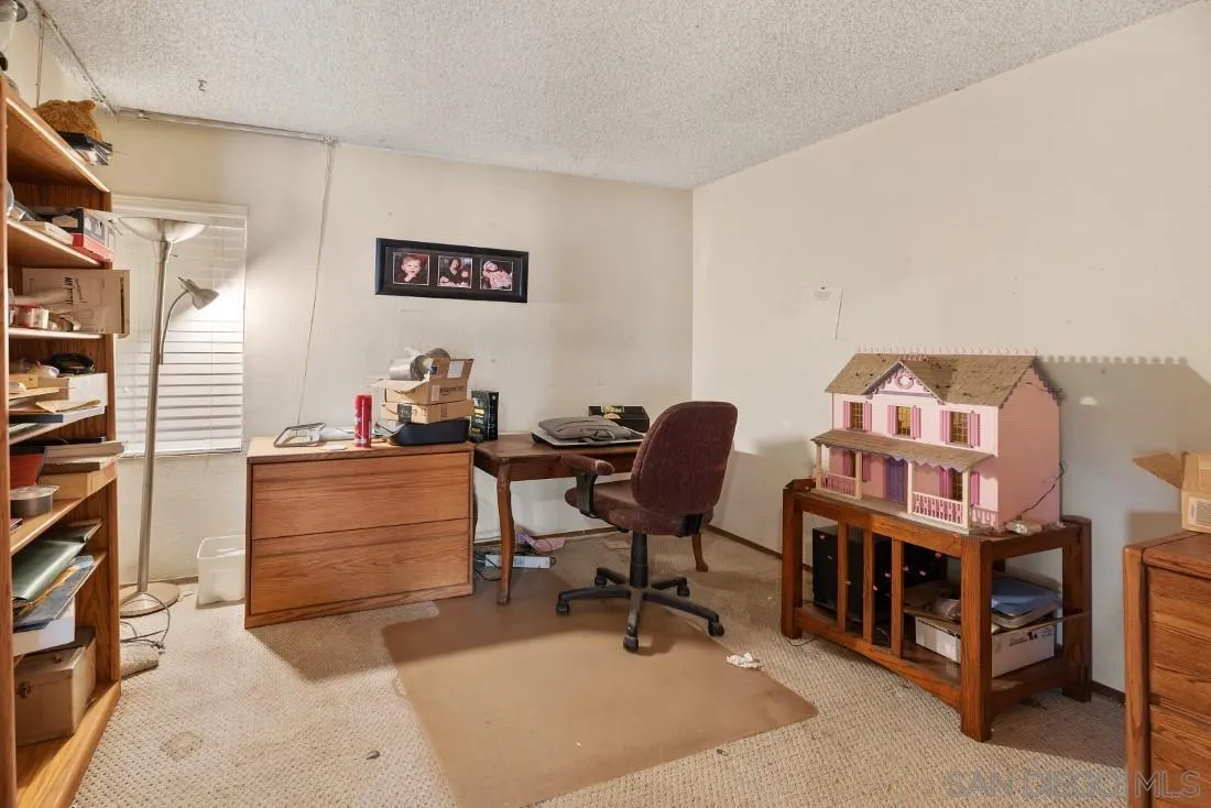 894 Coldstream Drive El Cajon, CA 92020 - Photo 27 of 30 a bedroom with furniture and a workspace