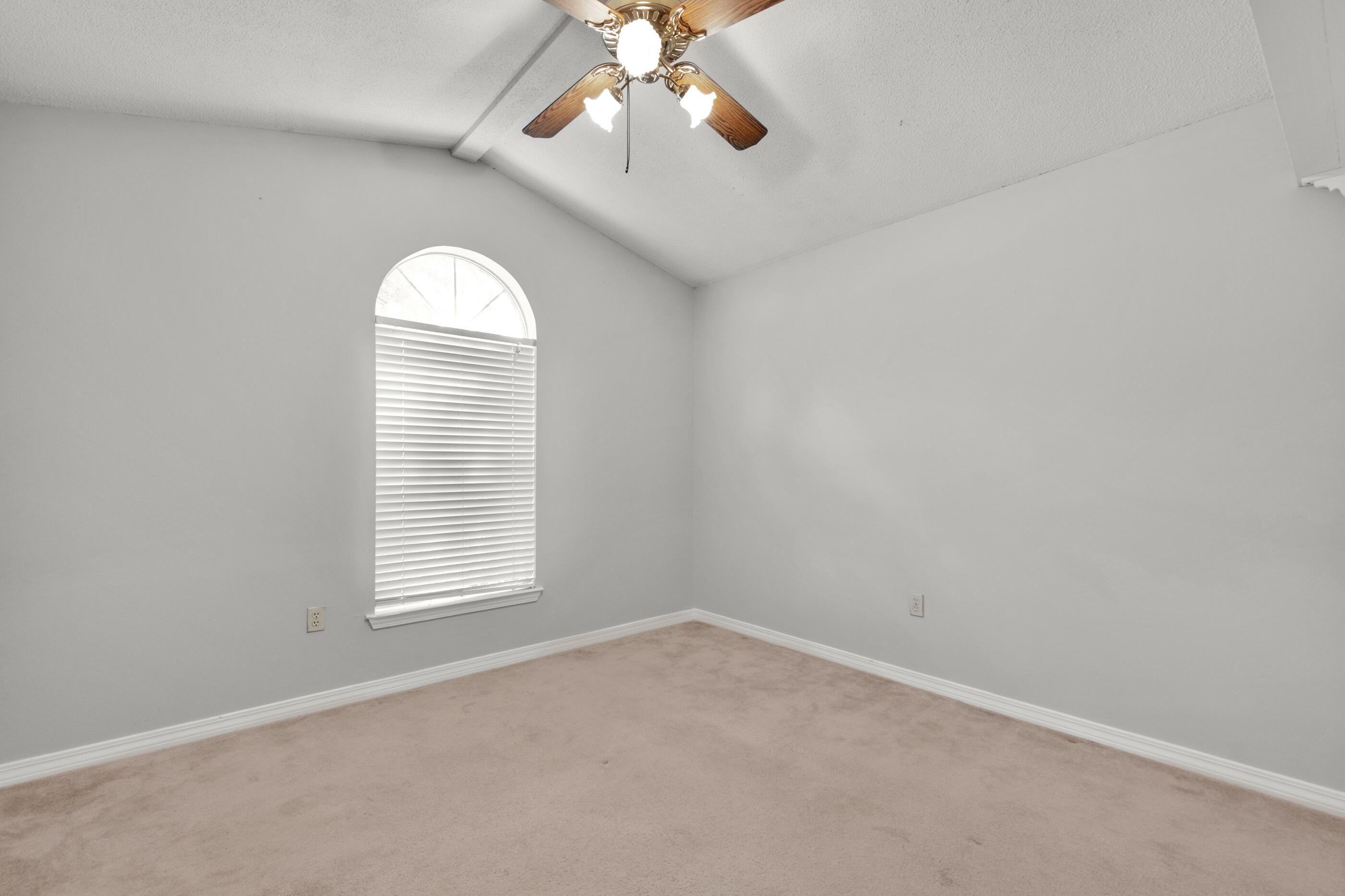 120 Wright Circle Niceville, FL 32578 - Photo 13 of 19 an empty room with windows and chandelier fan
