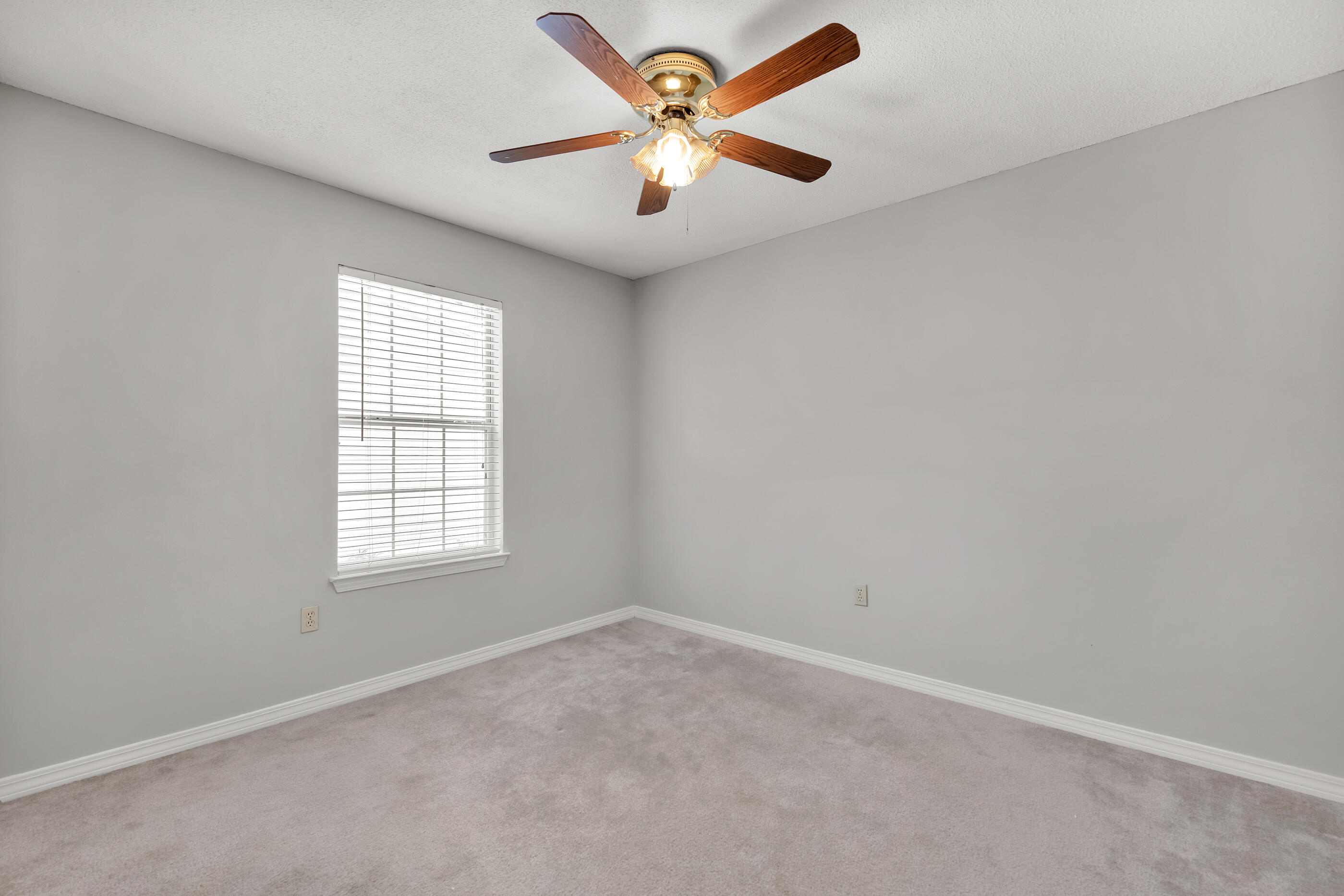 120 Wright Circle Niceville, FL 32578 - Photo 15 of 19 an empty room with windows and fan