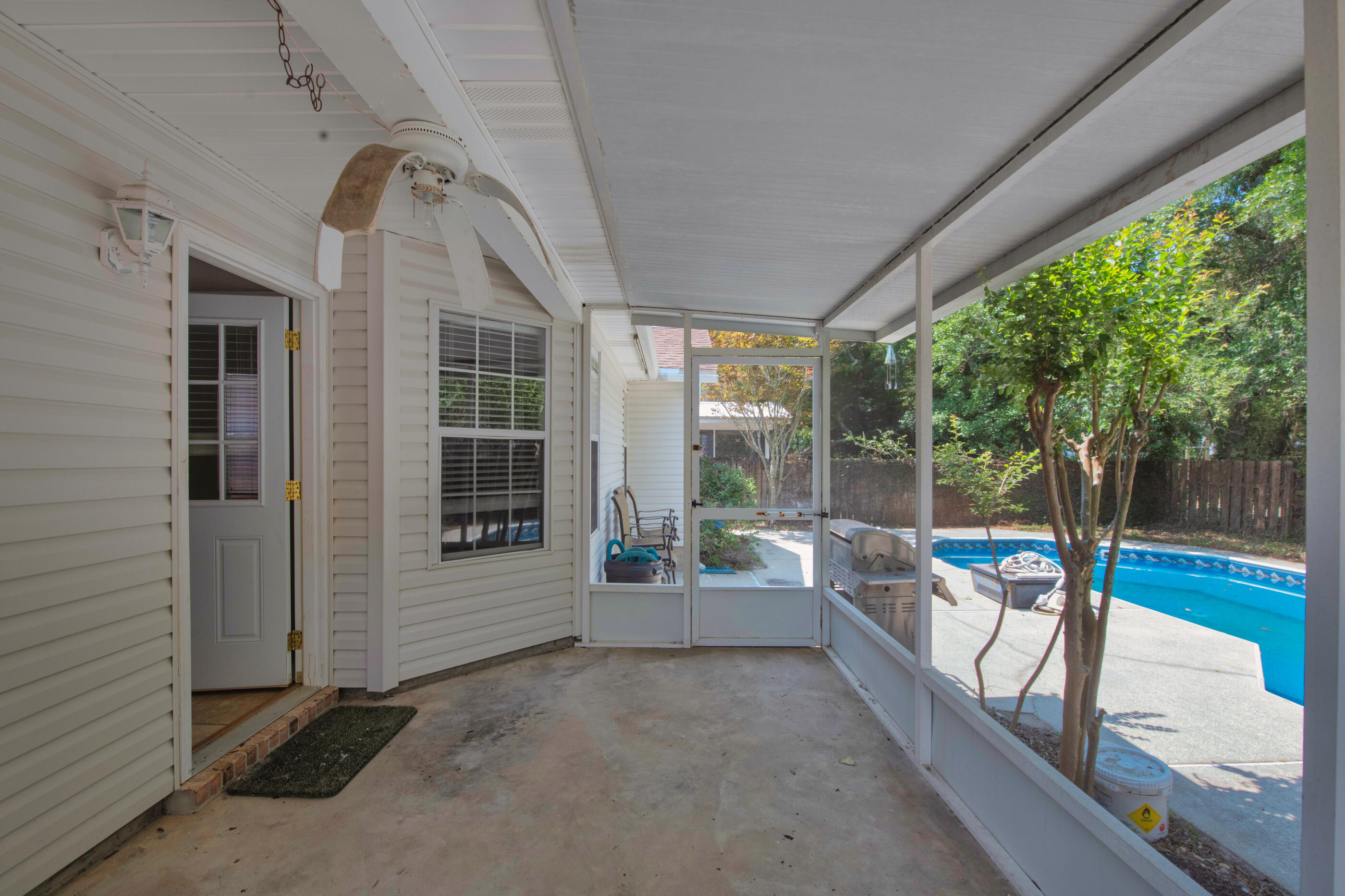 120 Wright Circle Niceville, FL 32578 - Photo 16 of 19 a view of a porch with furniture and garden