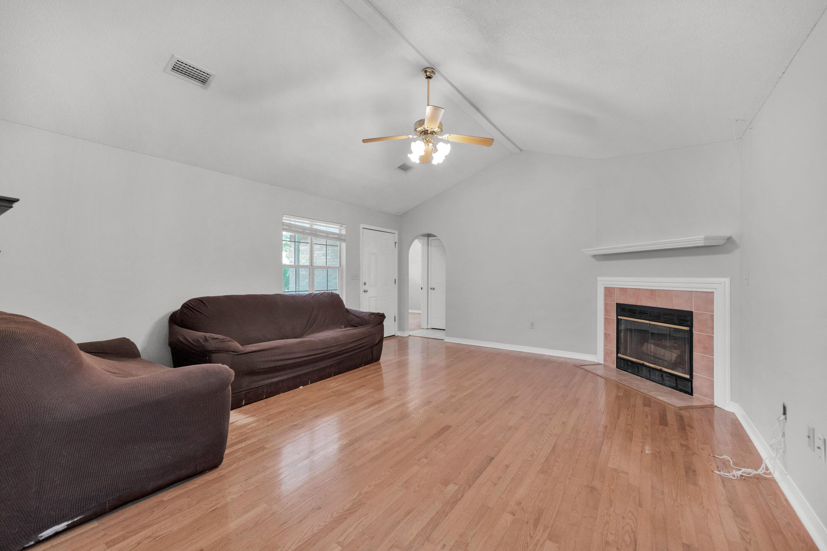 120 Wright Circle Niceville, FL 32578 - Photo 3 of 19 a living room with furniture and a fireplace