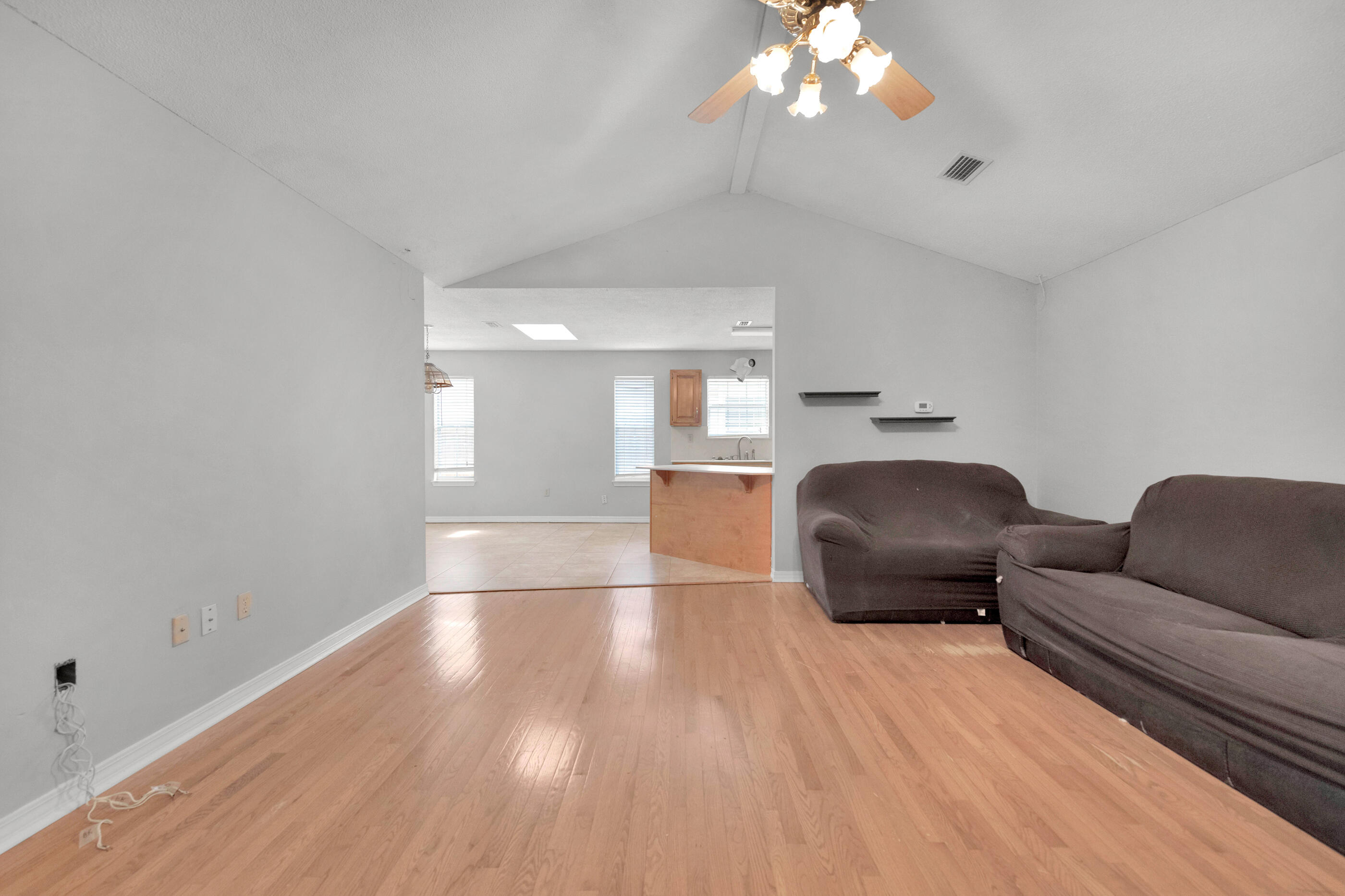 120 Wright Circle Niceville, FL 32578 - Photo 5 of 19 a living room with furniture and a chandelier