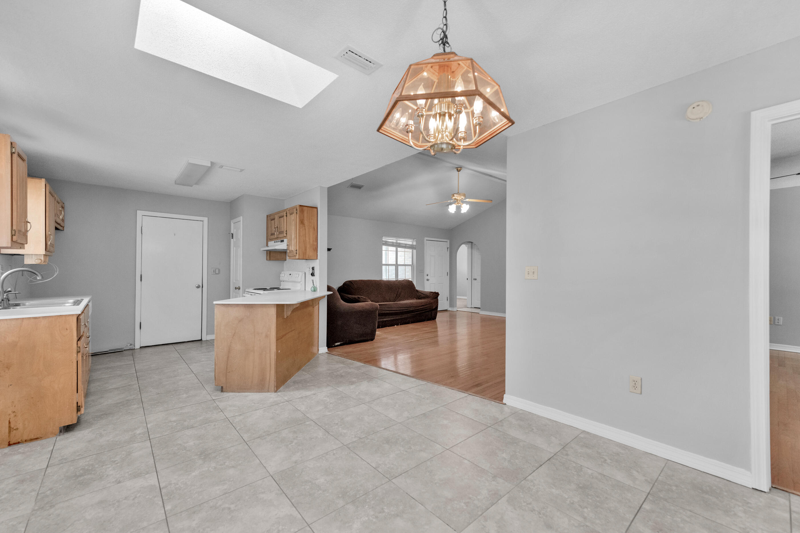 120 Wright Circle Niceville, FL 32578 - Photo 6 of 19 a view of a kitchen with a sink cabinets and a living room