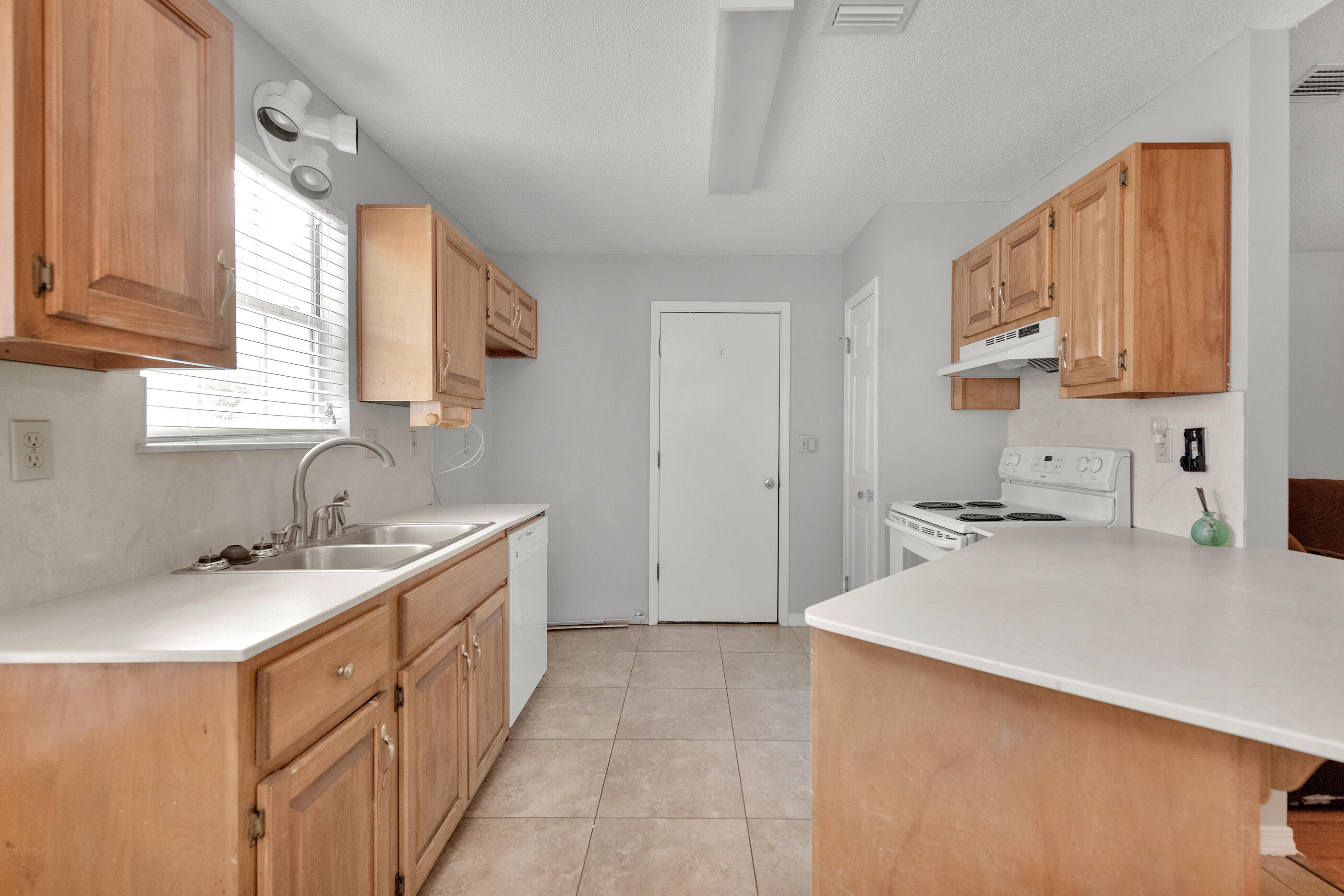 120 Wright Circle Niceville, FL 32578 - Photo 7 of 19 a kitchen with a sink stove top oven and cabinets
