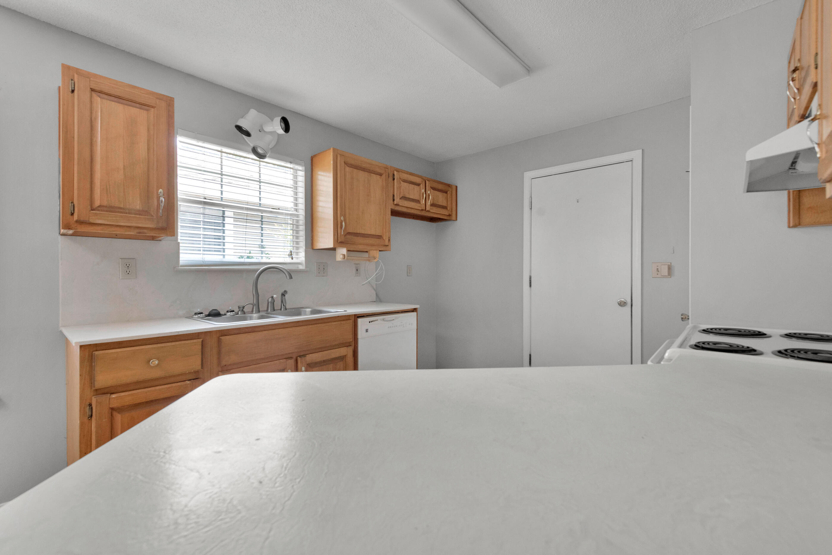 120 Wright Circle Niceville, FL 32578 - Photo 8 of 19 a kitchen with stainless steel appliances granite countertop a sink and a stove