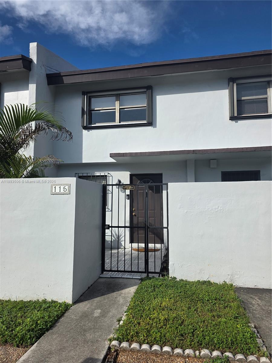8000 Southwest 152nd Avenue, Unit 115 Miami, FL 33193 - Photo 1 of 33 a front view of a house with balcony