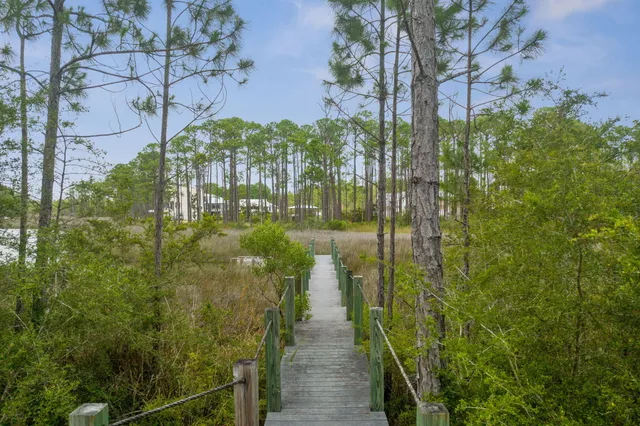 a view of a lake with houses in the back