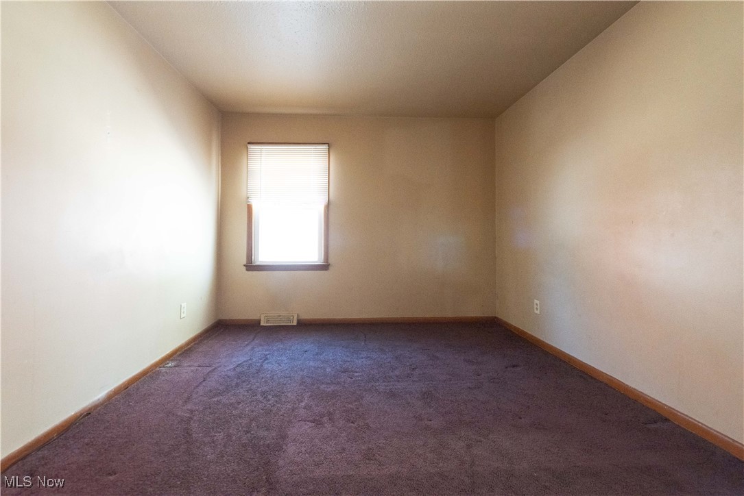 665 Babbitt Road Euclid, OH 44123 - Photo 8 of 17 Carpeted empty room with baseboards and visible vents