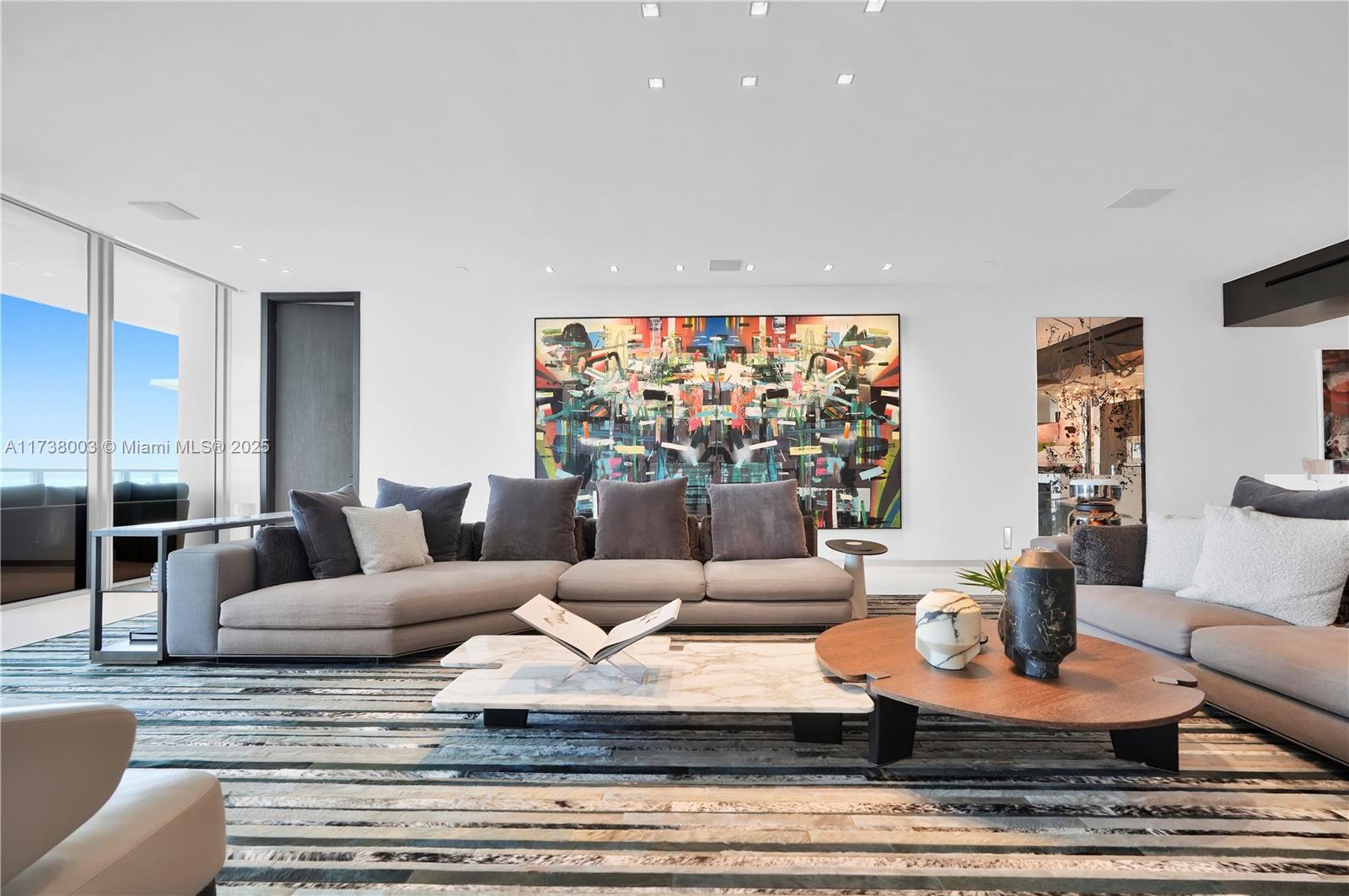 125 Ocean Drive, Unit PH Miami Beach, FL 33139 - Photo 14 of 56 a living room with furniture and a flat screen tv