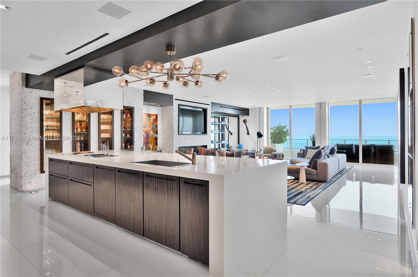 125 Ocean Drive, Unit PH Miami Beach, FL 33139 - Photo 16 of 56 a large white kitchen with a large window