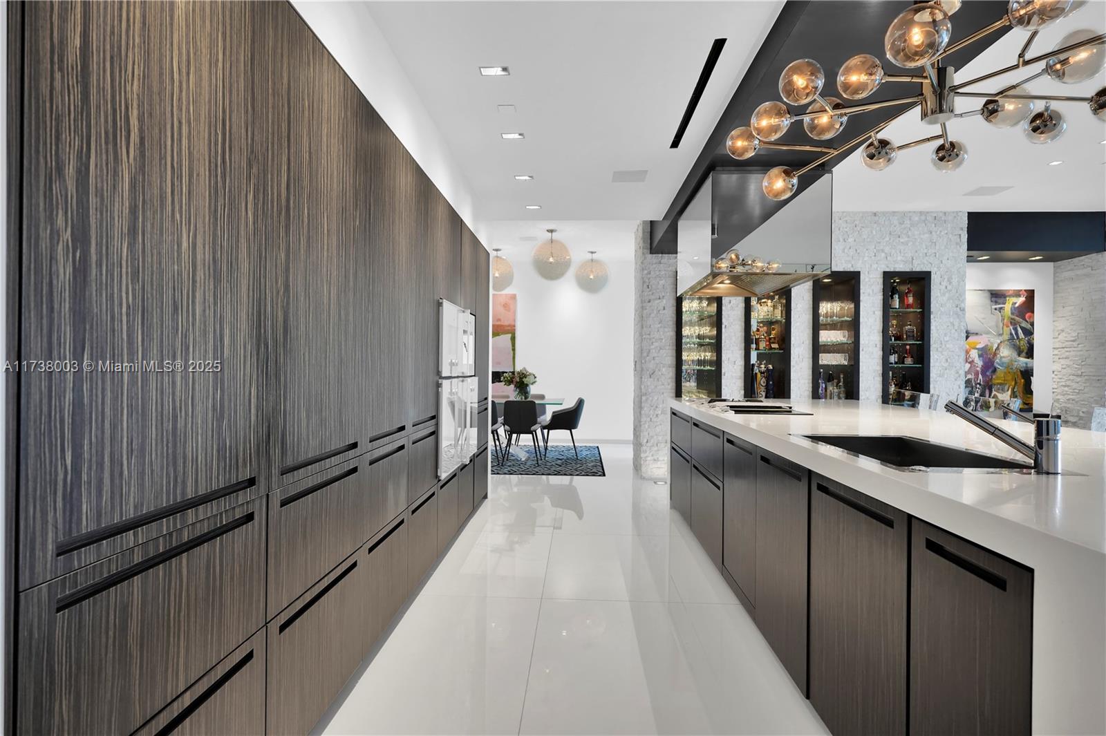 125 Ocean Drive, Unit PH Miami Beach, FL 33139 - Photo 18 of 56 a large kitchen with a large counter top