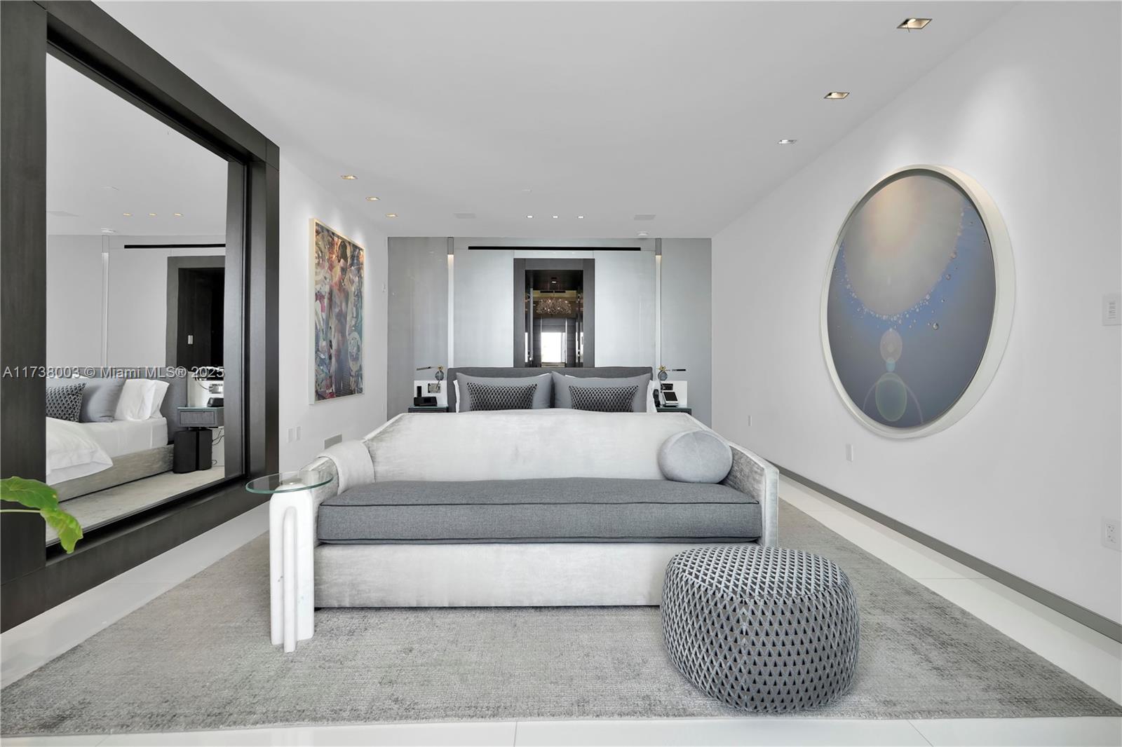 125 Ocean Drive, Unit PH Miami Beach, FL 33139 - Photo 22 of 56 a bedroom with a large bed and a mirror