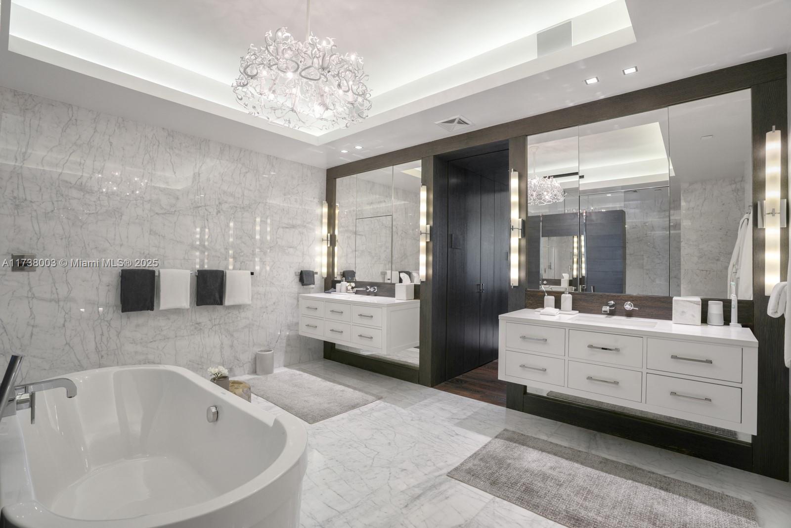 125 Ocean Drive, Unit PH Miami Beach, FL 33139 - Photo 24 of 56 a bathroom with a double vanity sink mirror and bathtub