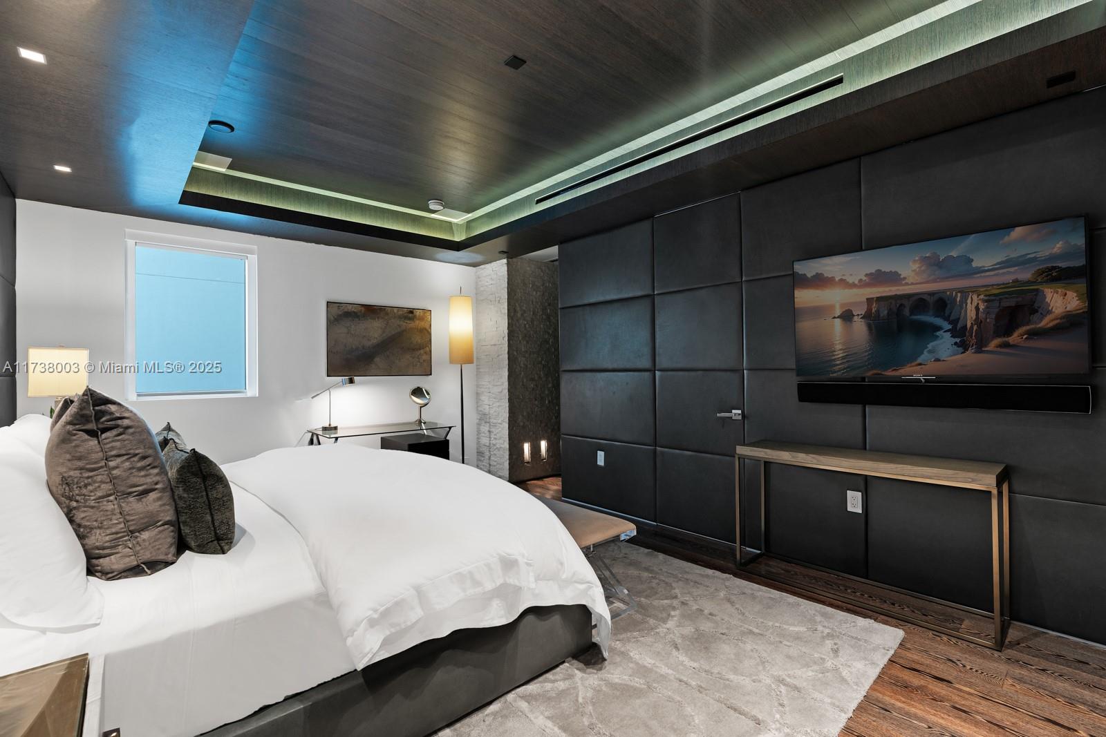 125 Ocean Drive, Unit PH Miami Beach, FL 33139 - Photo 25 of 56 a bedroom with a bed and a flat screen tv