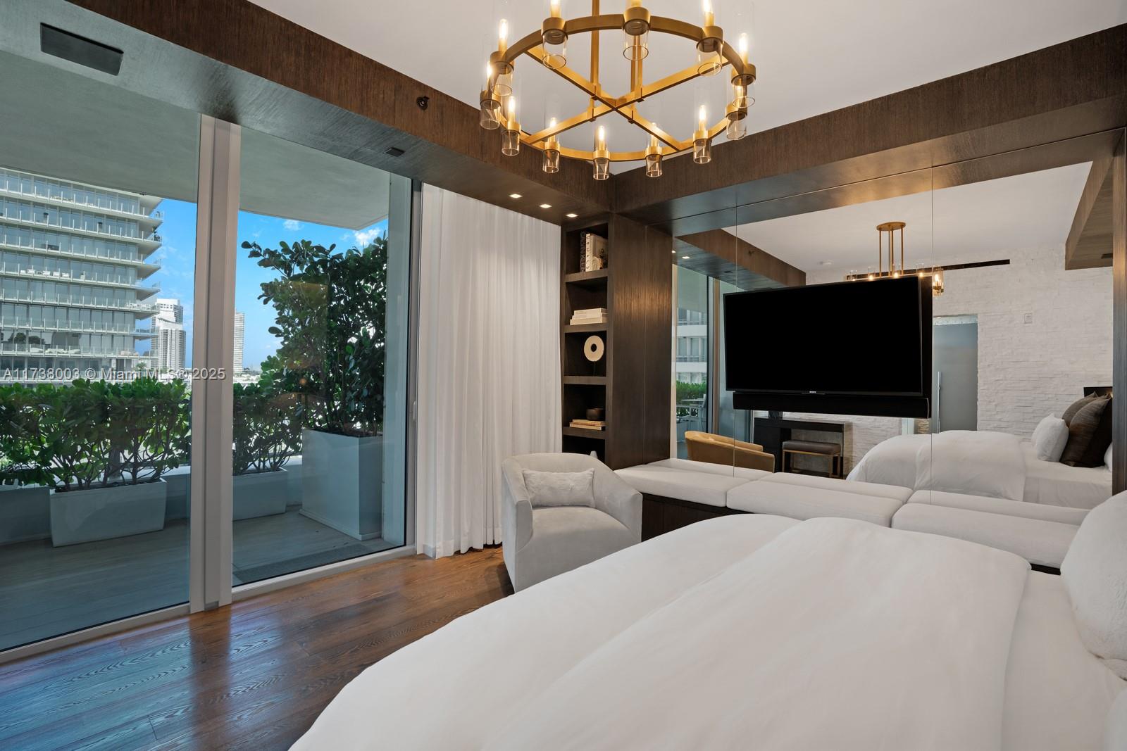 125 Ocean Drive, Unit PH Miami Beach, FL 33139 - Photo 32 of 56 a living room with furniture and a flat screen tv